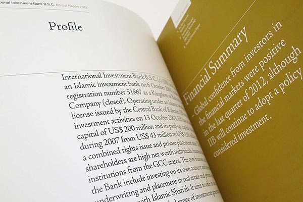 An open spread of the International Investment Bank B.S.C. 2012 Annual Report, showing a "Profile" page with descriptive text about the bank on the left and a gold-colored "Financial Summary" page on the right.