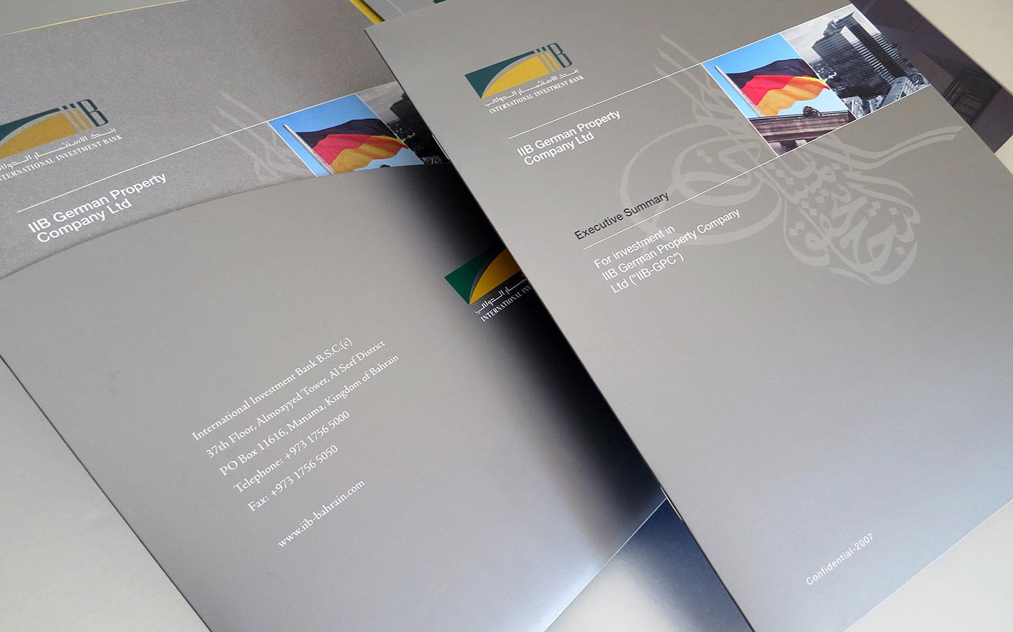 A grey-toned executive summary document and folder for "IIB German Property Company Ltd," featuring the International Investment Bank logo, a German flag, contact details for the bank in Bahrain, and the text "Confidential-2007."